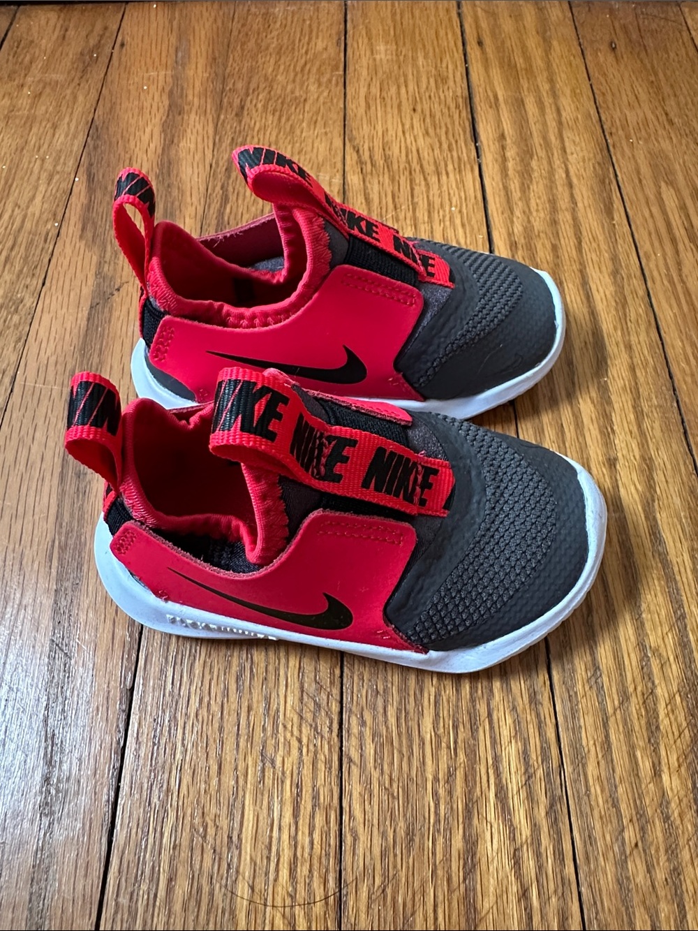 Nike Flexrunner Kids Slip-On Sneakers in Black and Red